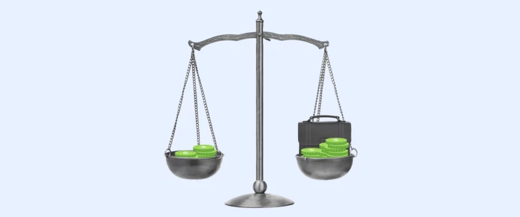 A balance with green coins on both sides. 