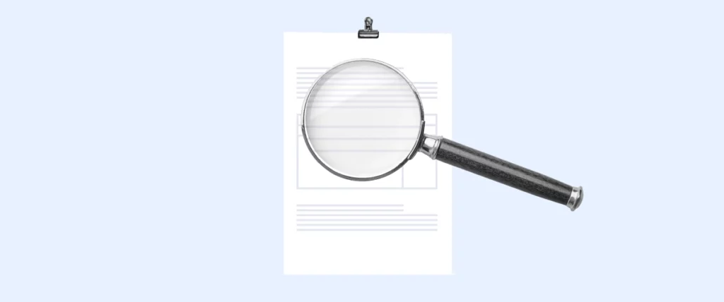 An invoice overviewed by a magnifying glass. 