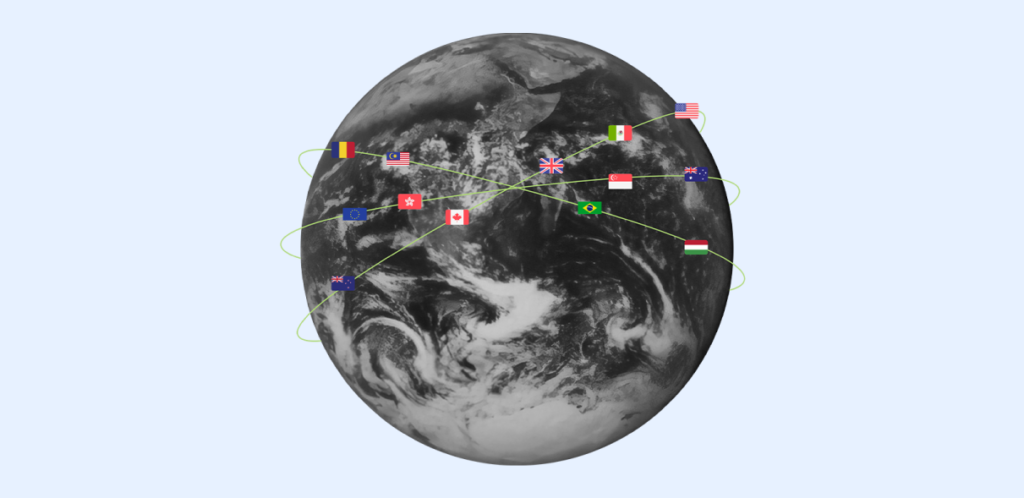 A global network of supply chain connections illustrated by flags of various countries linked with green lines across a grayscale image of the Earth, symbolizing international business and the management of global checking accounts.