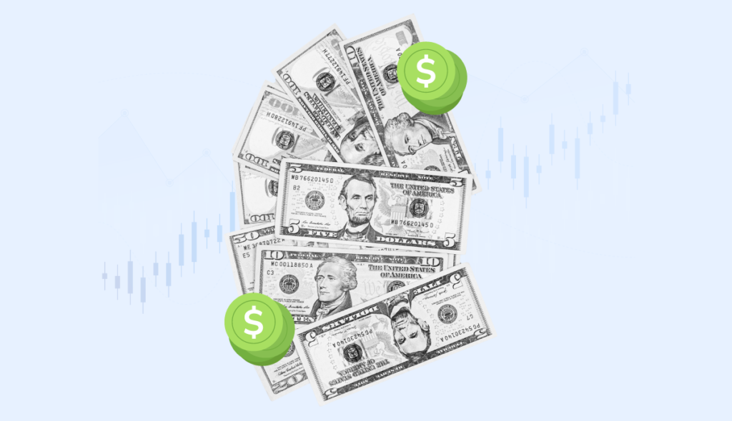 A collection of US dollar bills fanned out with two oversized green dollar sign symbols on top, all against a faint backdrop of a stock market graph, suggesting financial growth or investment.