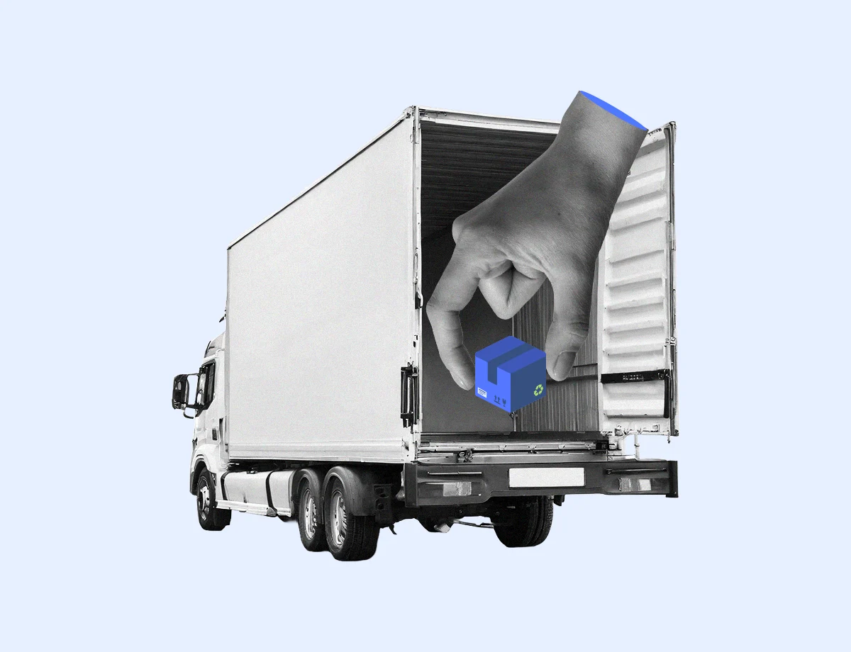 A giant hand in a business suit cuff places a blue package into the back of a delivery truck, illustrating the concept of logistics and package handling in business operations.