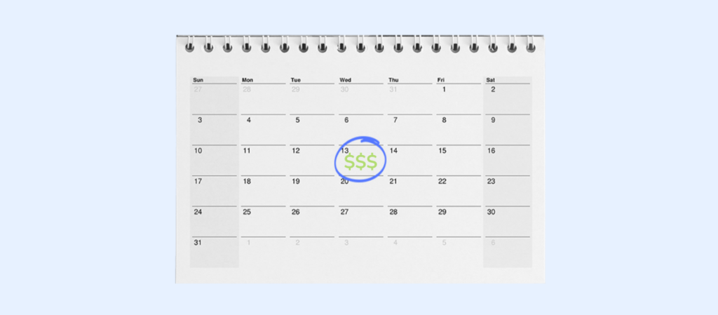 A calendar marked with a blue circle and some $ signs on it. 