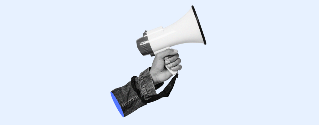 A megaphone being held by a hand, alluding to effective communication. 

