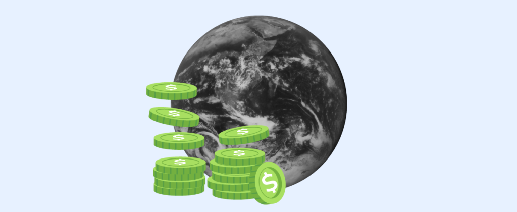 A monochromatic globe with some green coins in front of it. 