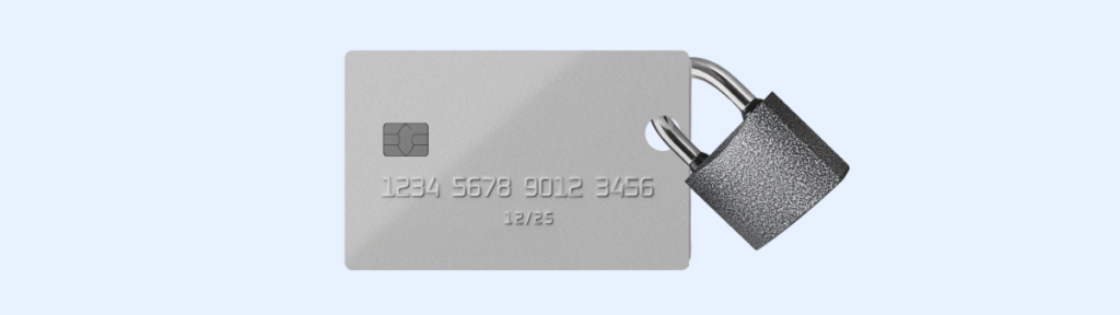 A silver credit card with embossed numbers '1234 5678 9012 3456' and expiration date '12/25' secured with a padlock, symbolizing secure digital business transactions.