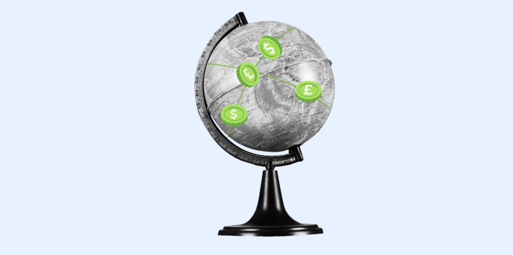 A monochromatic globe with four green coins of different currencies alluding to transactions of a multi currency account. 