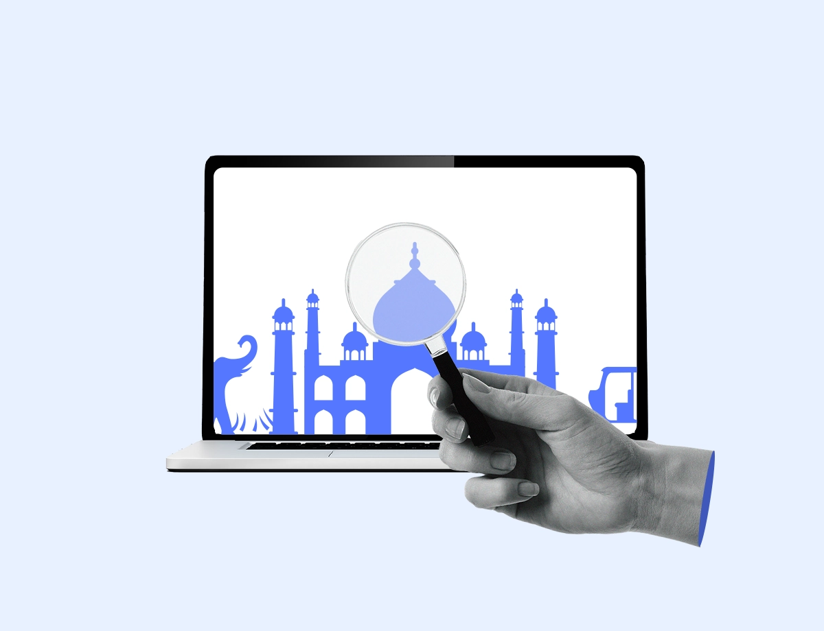 A computer screen displaying the Taj Mahal while being viewed by a magnifying glass.